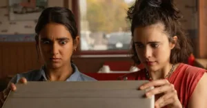 Geraldine Viswanathan and Margaret Qualley in Drive-Away Dolls (2024), directed by Ethan Coen