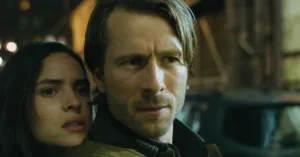 Adria Arjona and Glen Powell in Hit Man (2024)